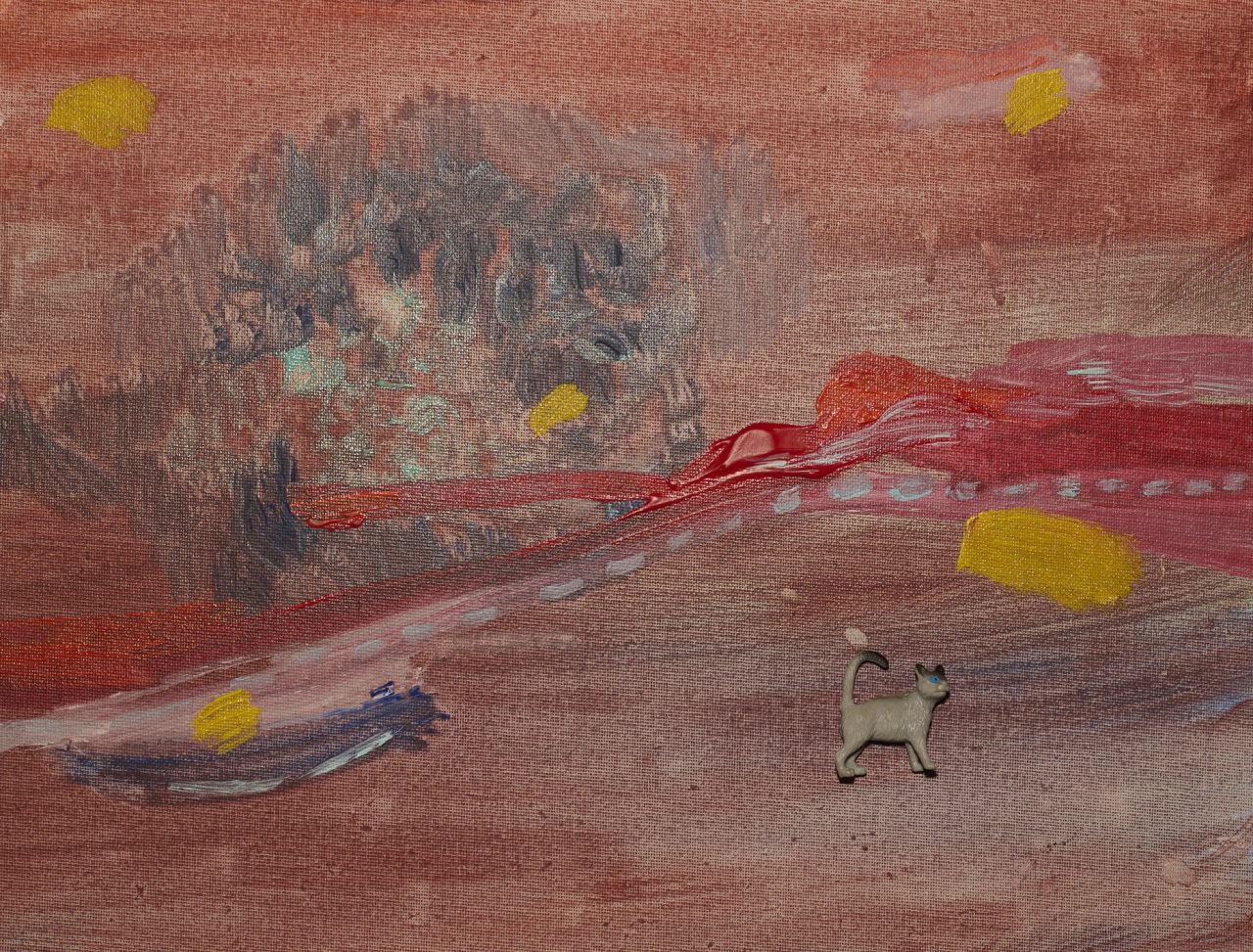 Abstract painting with red hues and small animal figures.