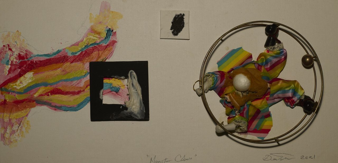 Colorful drawings and a basket of art supplies on a table.
