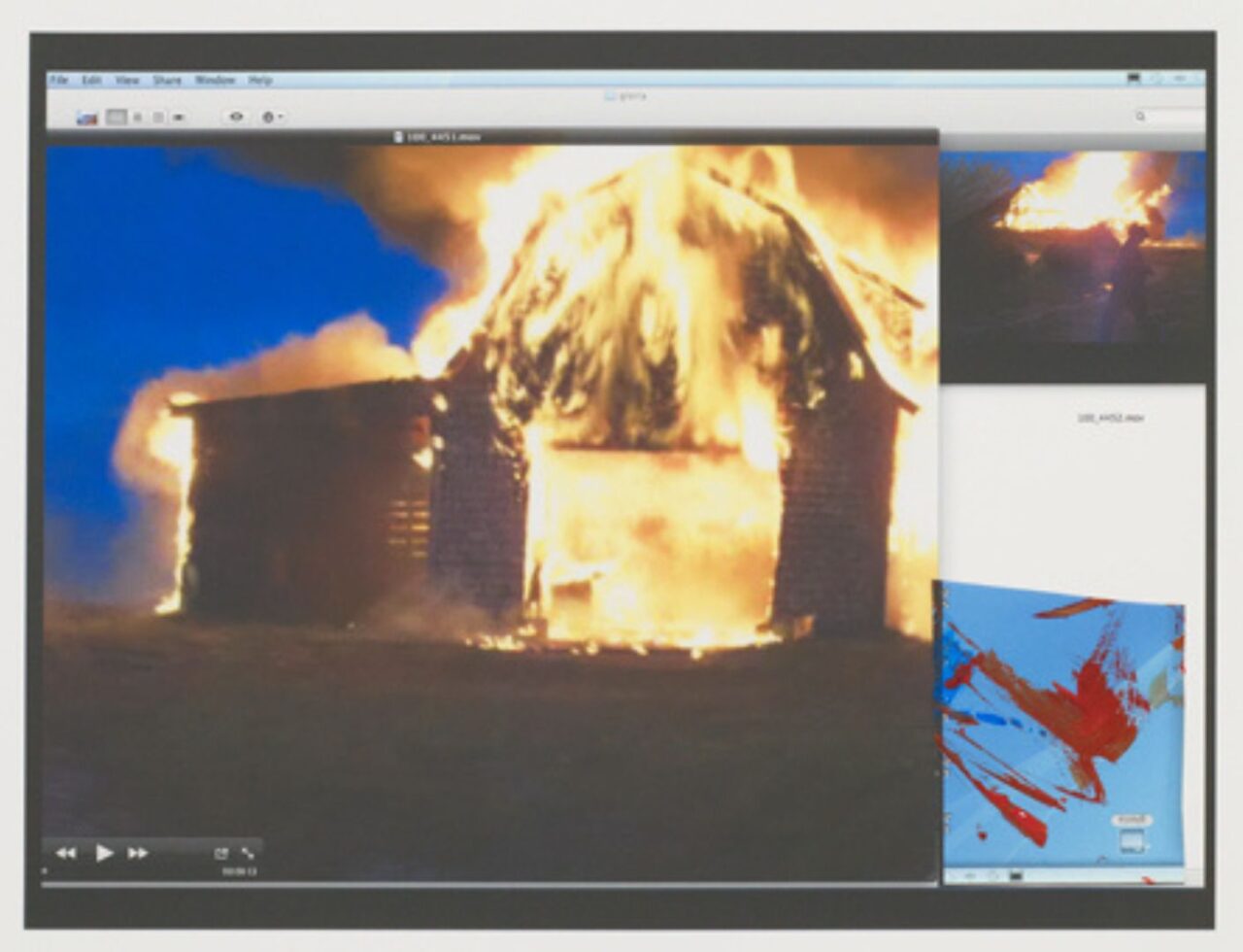 A house engulfed in flames during a fire incident at night.