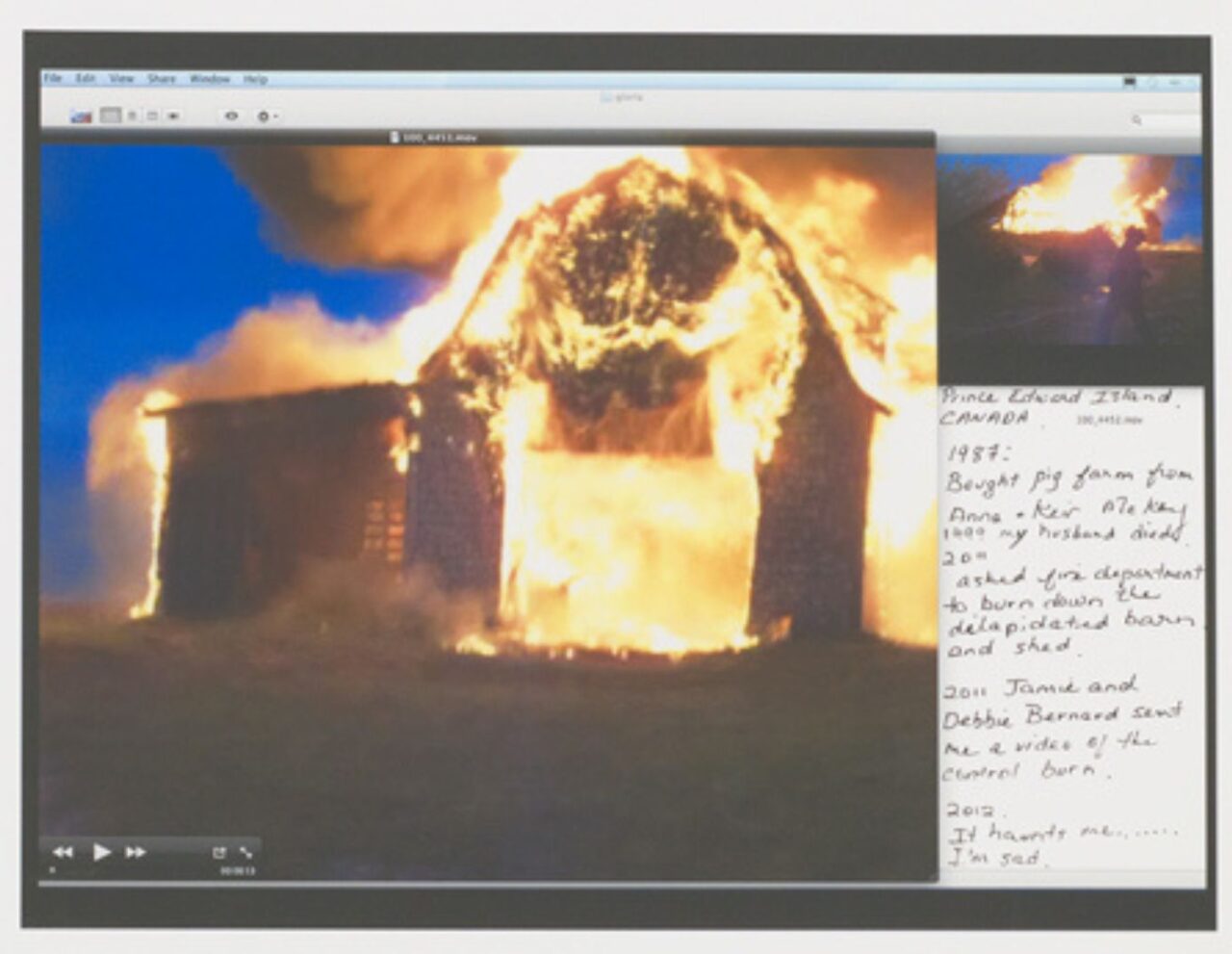 A house engulfed in flames at night.